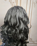 Tresspoint Full Bloom lace front wig in 1B off black, 250 density, shown from the back with loose waves
