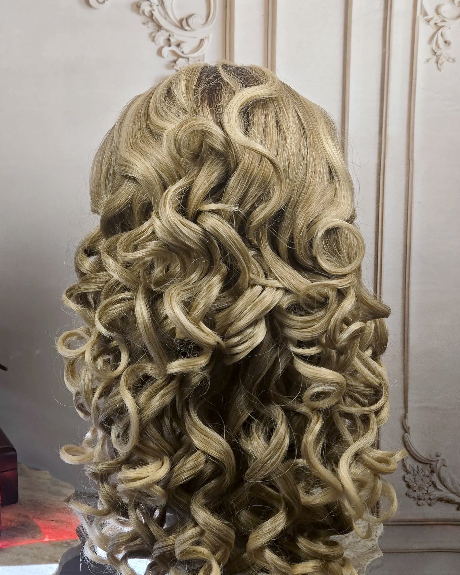 Tresspoint Full Bloom lace front wig in R6/613 blonde, shown from the back with defined curls