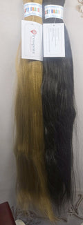 Tresspoint Kanekalon braiding hair in 27 honey blonde and 1B off black, shown full length with Tresspoint hang tags